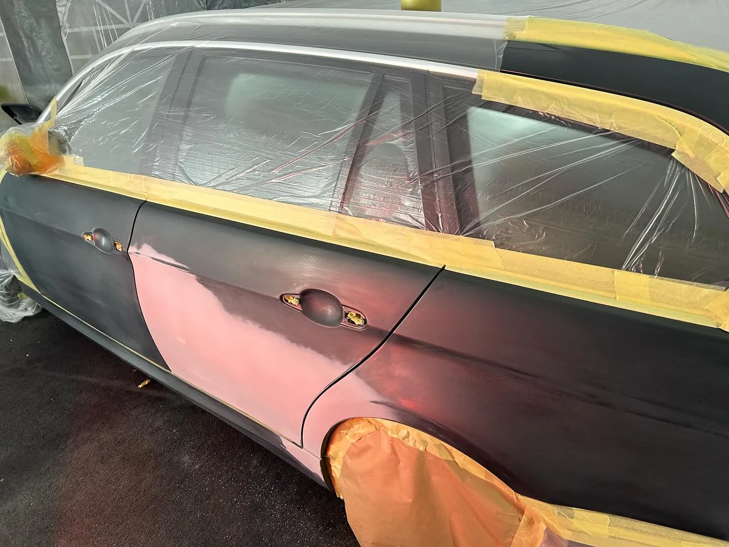 A car that has been wrapped in plastic.