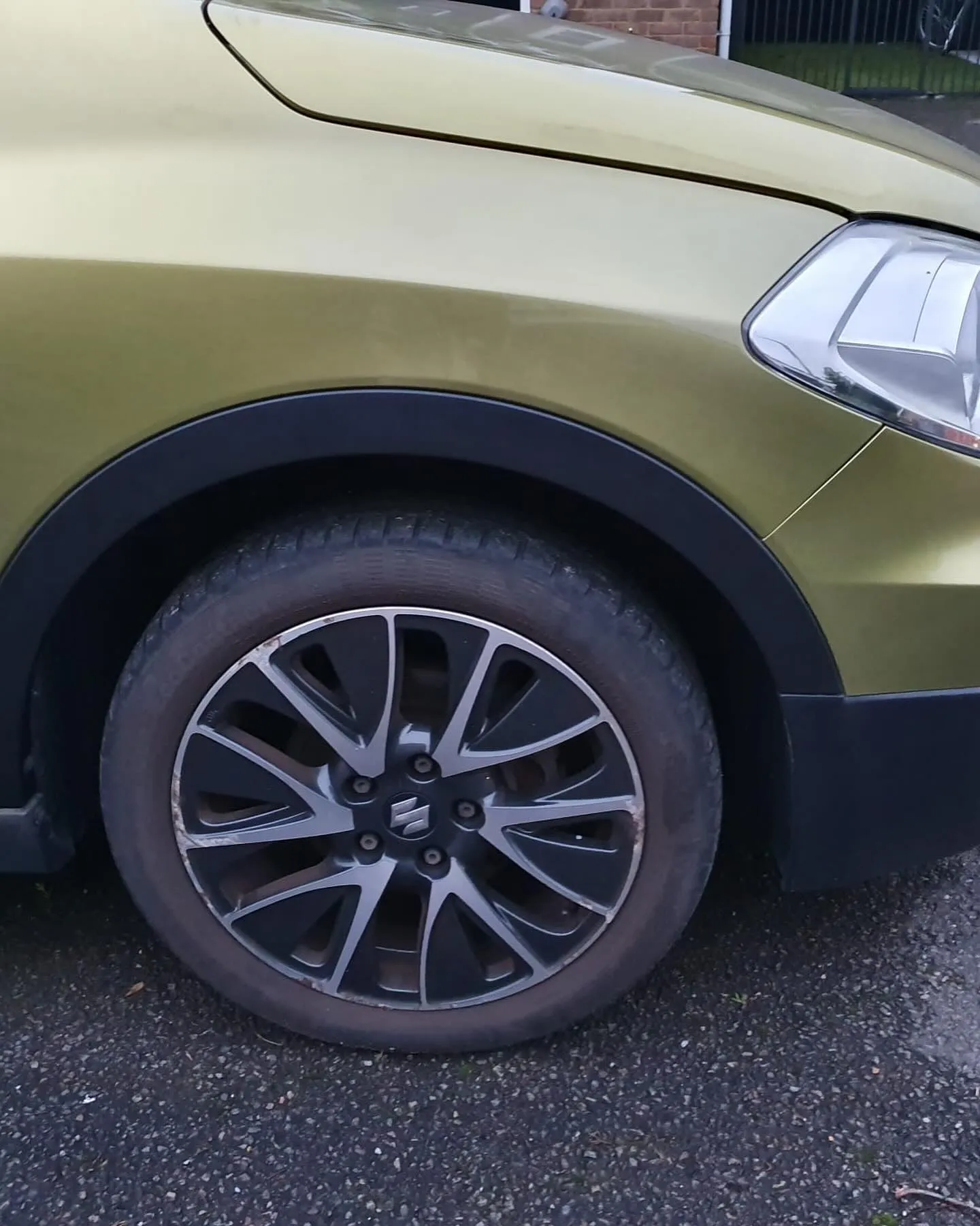 A close up of a car parked in a parking lot.