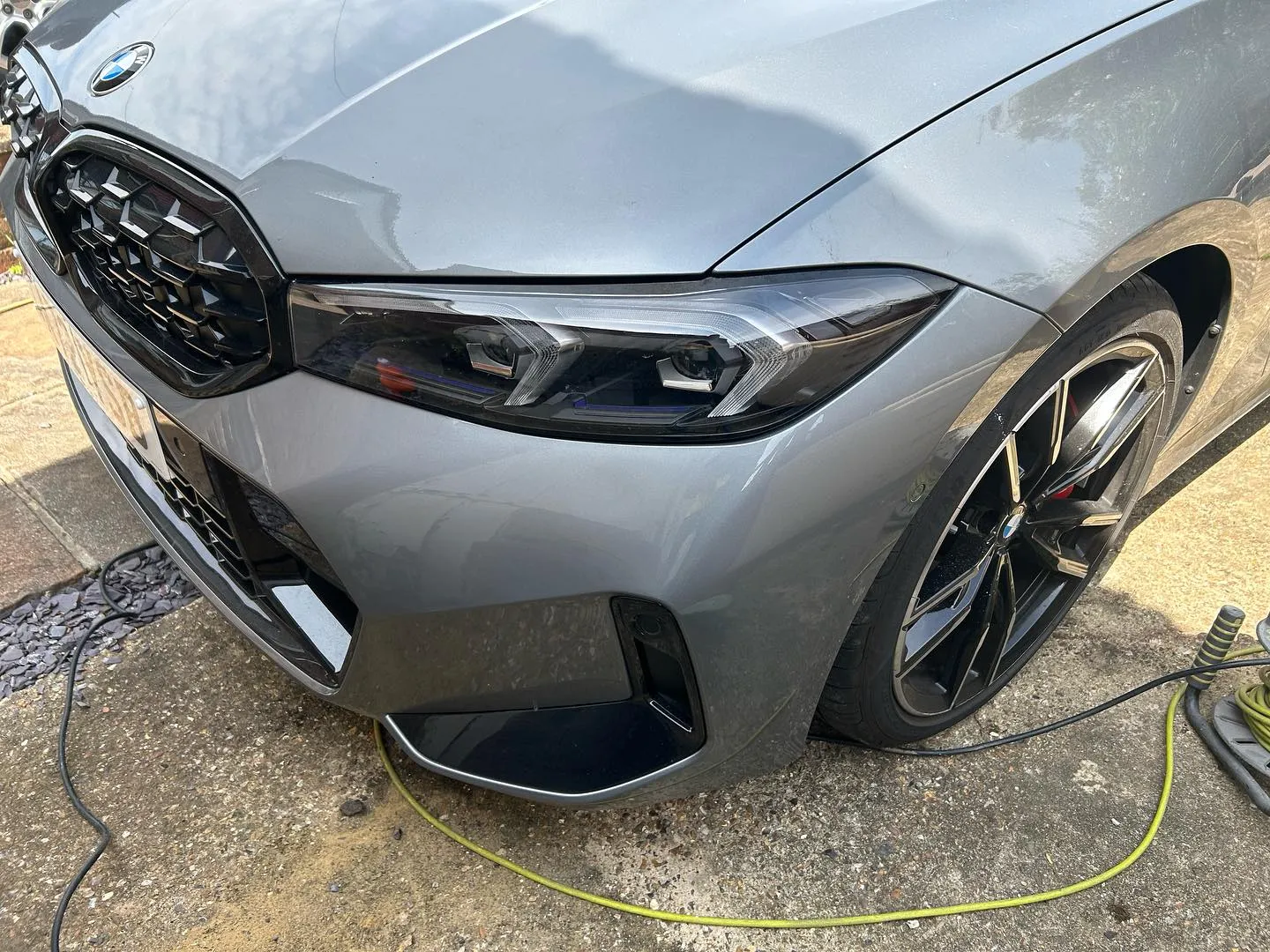 An electric car plugged in to a charger.